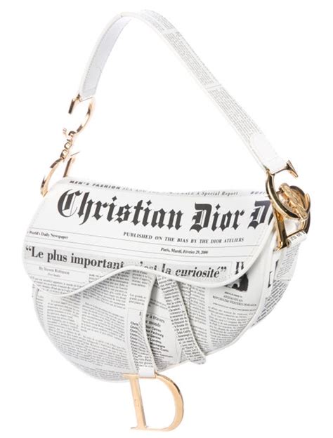 Christian Dior Newspaper Leather Saddle Bag .